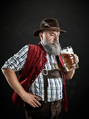 Image showing Germany, Bavaria, Upper Bavaria, man with beer dressed in in traditional Austrian or Bavarian costume