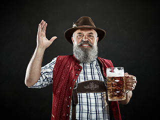 Image showing Germany, Bavaria, Upper Bavaria, man with beer dressed in in traditional Austrian or Bavarian costume