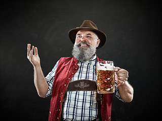 Image showing Germany, Bavaria, Upper Bavaria, man with beer dressed in in traditional Austrian or Bavarian costume