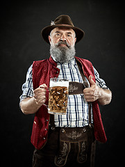 Image showing Germany, Bavaria, Upper Bavaria, man with beer dressed in in traditional Austrian or Bavarian costume