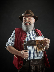 Image showing Germany, Bavaria, Upper Bavaria, man with beer dressed in in traditional Austrian or Bavarian costume