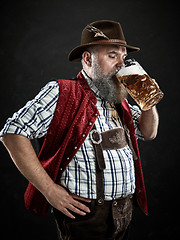 Image showing Germany, Bavaria, Upper Bavaria, man with beer dressed in in traditional Austrian or Bavarian costume