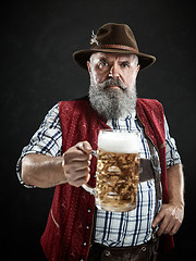 Image showing Germany, Bavaria, Upper Bavaria, man with beer dressed in in traditional Austrian or Bavarian costume