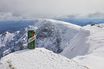 Image showing A can of Zlaty Bazant beer on a mountain