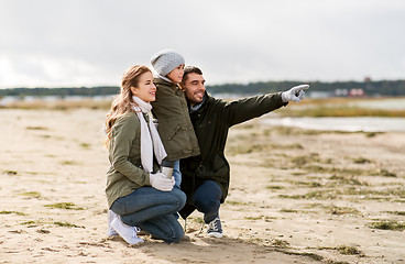 Image showing happy family on autumn beach