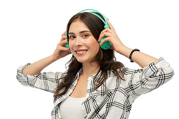 Image showing happy young woman or teenage girl with headphones