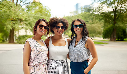 Image showing happy young women in sunglasses at summer park