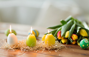 Image showing candles in shape of easter eggs and tulip flowers