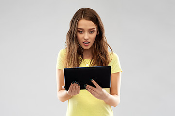 Image showing young woman or teenage girl using tablet computer