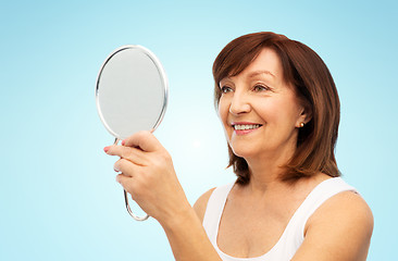 Image showing portrait of smiling senior woman with mirror