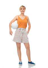 Image showing smiling teenage girl with volleyball