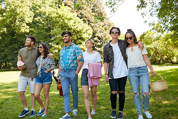 Image showing friends with guitar and picnic blanket at park