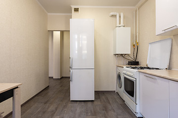 Image showing Interior of a small kitchen with a gas boiler