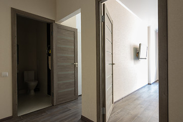 Image showing Corridor in a small apartment, open doors
