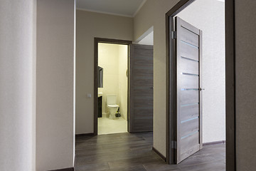 Image showing Corridor in a small apartment, open doors to the bathroom and room