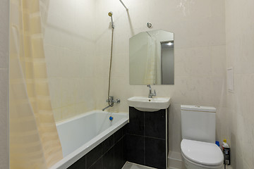 Image showing Interior of a small combined bathroom and toilet