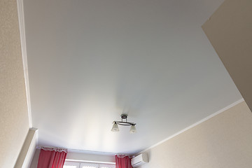 Image showing Stretched white matte ceiling in the room close-up