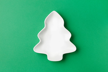 Image showing empty white bowl on green background