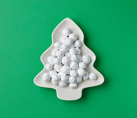 Image showing cranberries covered with powdered sugar on fir shape plate