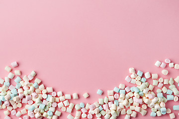 Image showing mini marshmallows on pink background