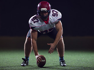 Image showing American football player starting football game