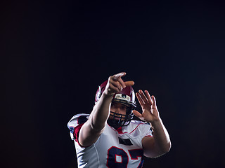 Image showing american football player throwing rugby ball