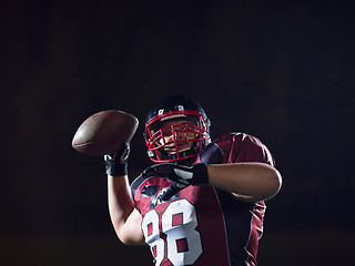 Image showing american football player throwing rugby ball