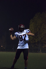 Image showing american football player throwing rugby ball