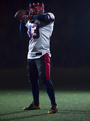 Image showing american football player throwing rugby ball