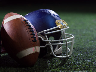 Image showing closeup of american football and helmet