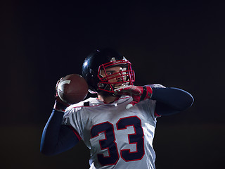 Image showing american football player throwing rugby ball