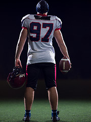 Image showing rear view of young confident American football player