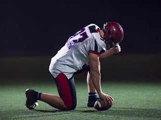 Image showing American football player starting football game