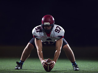 Image showing American football player starting football game