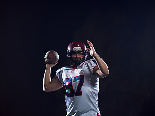 Image showing american football player throwing rugby ball