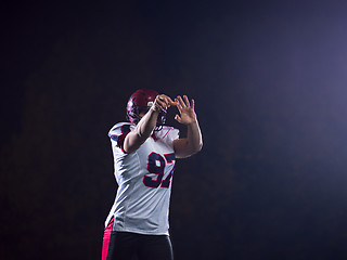 Image showing american football player throwing rugby ball