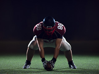 Image showing American football player starting football game