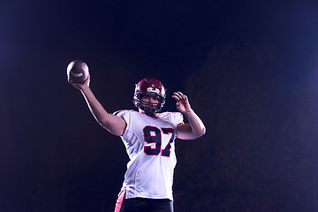 Image showing american football player throwing rugby ball