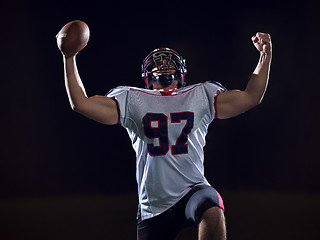 Image showing american football player celebrating after scoring a touchdown