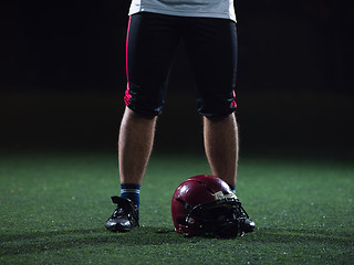 Image showing closeup of american football player and helmet