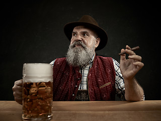 Image showing Germany, Bavaria, Upper Bavaria, man with beer dressed in in traditional Austrian or Bavarian costume