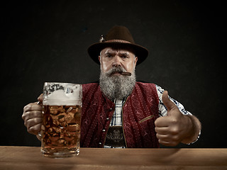 Image showing Germany, Bavaria, Upper Bavaria, man with beer dressed in in traditional Austrian or Bavarian costume