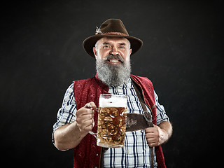 Image showing Germany, Bavaria, Upper Bavaria, man with beer dressed in in traditional Austrian or Bavarian costume