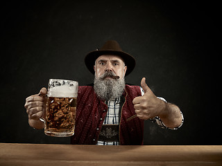 Image showing Germany, Bavaria, Upper Bavaria, man with beer dressed in in traditional Austrian or Bavarian costume