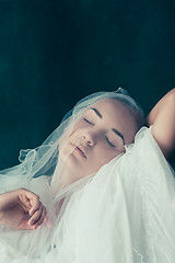Image showing Beautiful bride looking over her veil