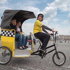 Image showing man driving in bicycle taxi