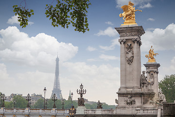 Image showing Golden monuments on the bridge Pont Alexander III bridge in Paris overlooking the background the eiffel tower