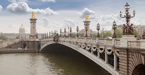 Image showing Panorama with Pont Alexandre III Bridge and overlooking the old city, cloudy day. France Paris