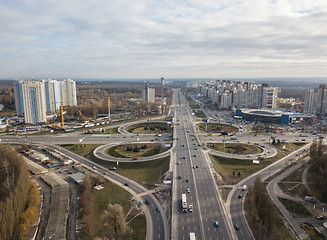 Image showing Modern city with of Odessa square and road in the form of a quatrefoil on a background of a cloudy sky . Aerial view from the drone. Kiev, Ukraine