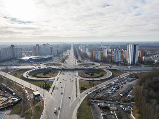 Image showing Kiev, Ukraine panoramic view of the city with high-rise buildings and a road junctionof Odessa square in the shape of a quatrefoil against the sky. Aerial view from the drone